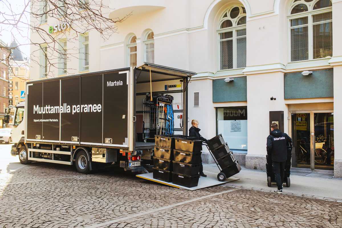 Removal staff move removal boxes.