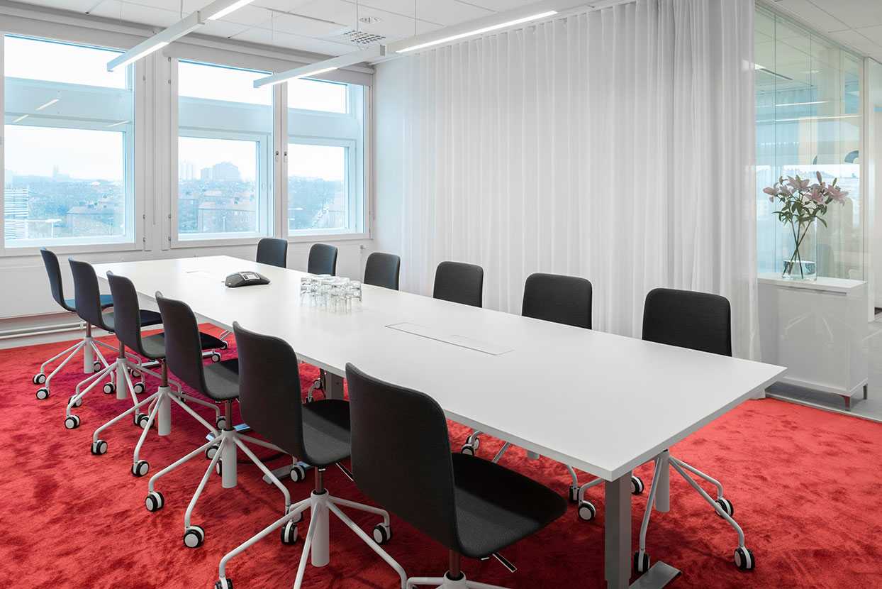Martela's Sola chairs and Frankie table at Vitec's office in Stockholm, Sweden